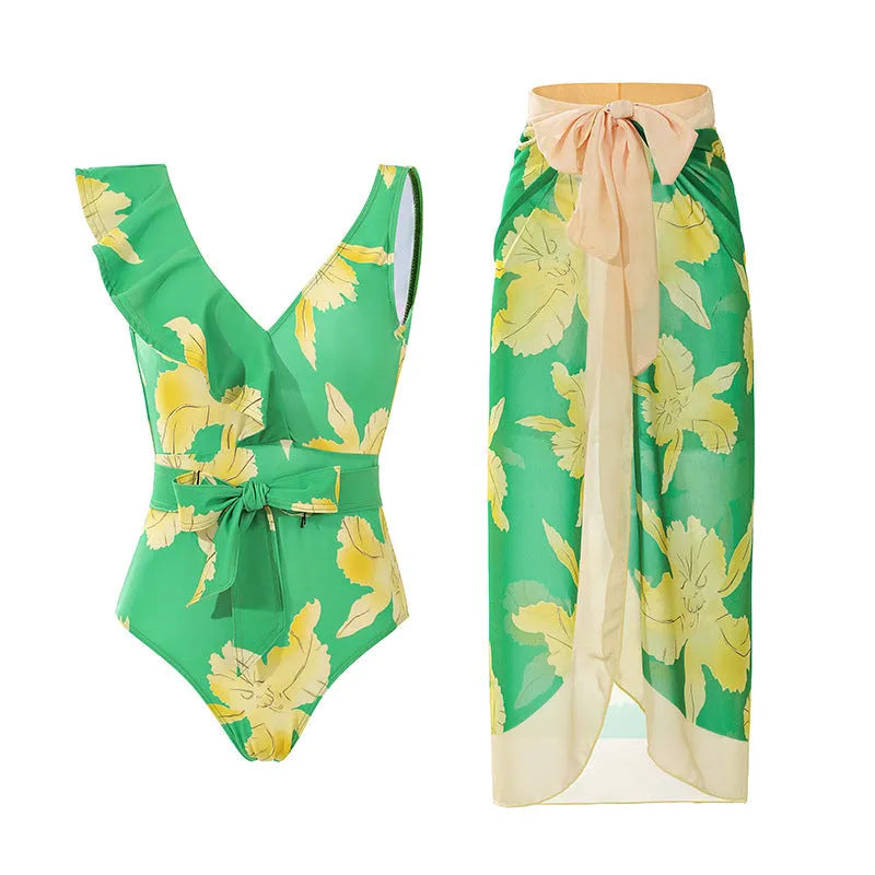 Women's solid colour one-piece swimsuit with thin spaghetti straps and a matching removable skirt.