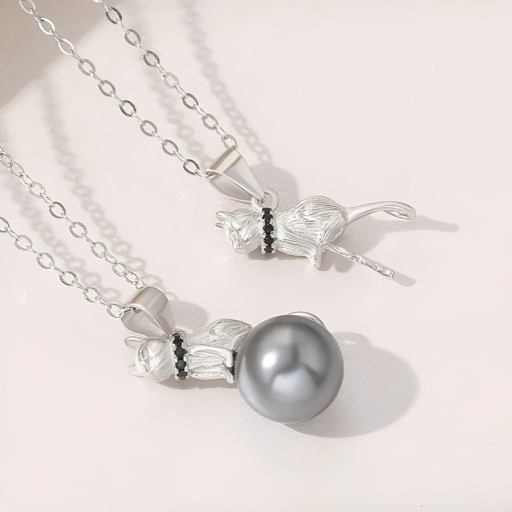 Sterling silver cat pendant necklace with adjustable chain, showing delicate feline silhouette charm
