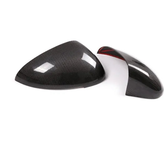 Pair of true carbon fibre rearview mirror covers for Porsche Macan, showing black woven texture.