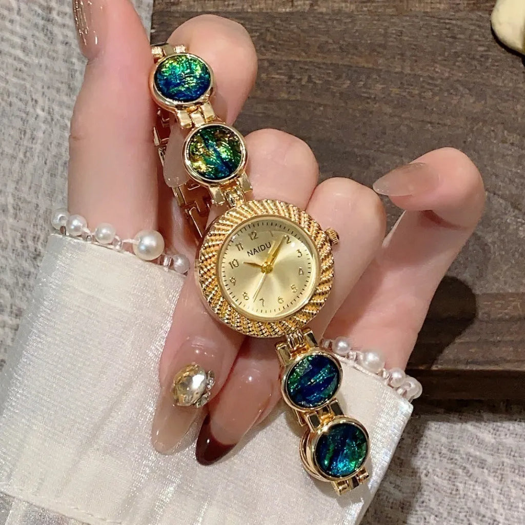 Women's round quartz watch with 25mm dial in one of six colours: milky white, dark green, purple, light green, cherry pink, or orange pink.