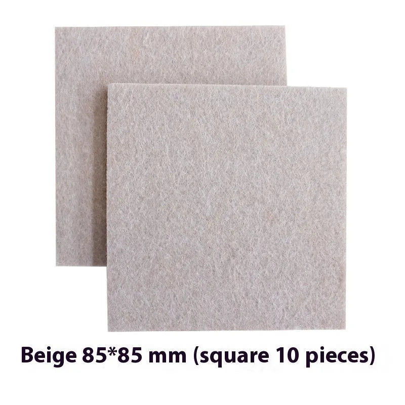 Beige plastic furniture leg stopper pads in five different sizes on a wooden floor