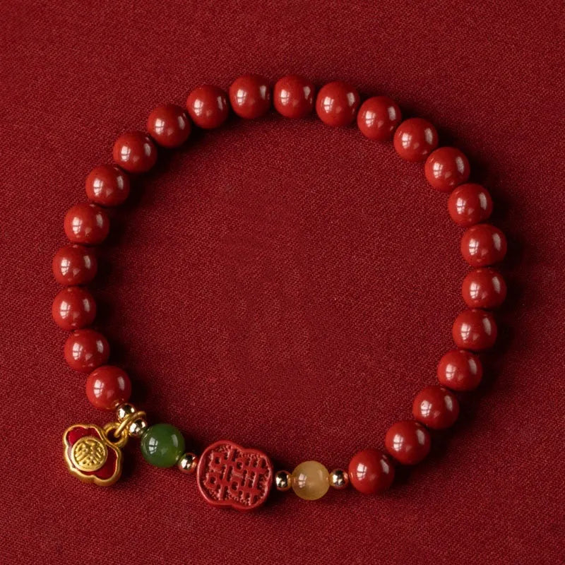 Happy Eyebrow Bracelet with fu character bead on raw emperor sandstone cinnabar beads.