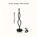 Black aluminium desk lamp with touch dimming and a three-colour button on a desktop