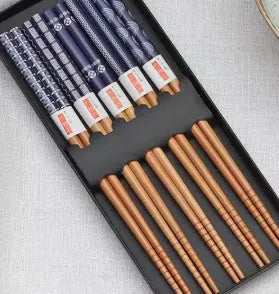 Set of five Japanese style patterned bamboo chopsticks showing lucky cat and pool elegant blue cartoon designs.
