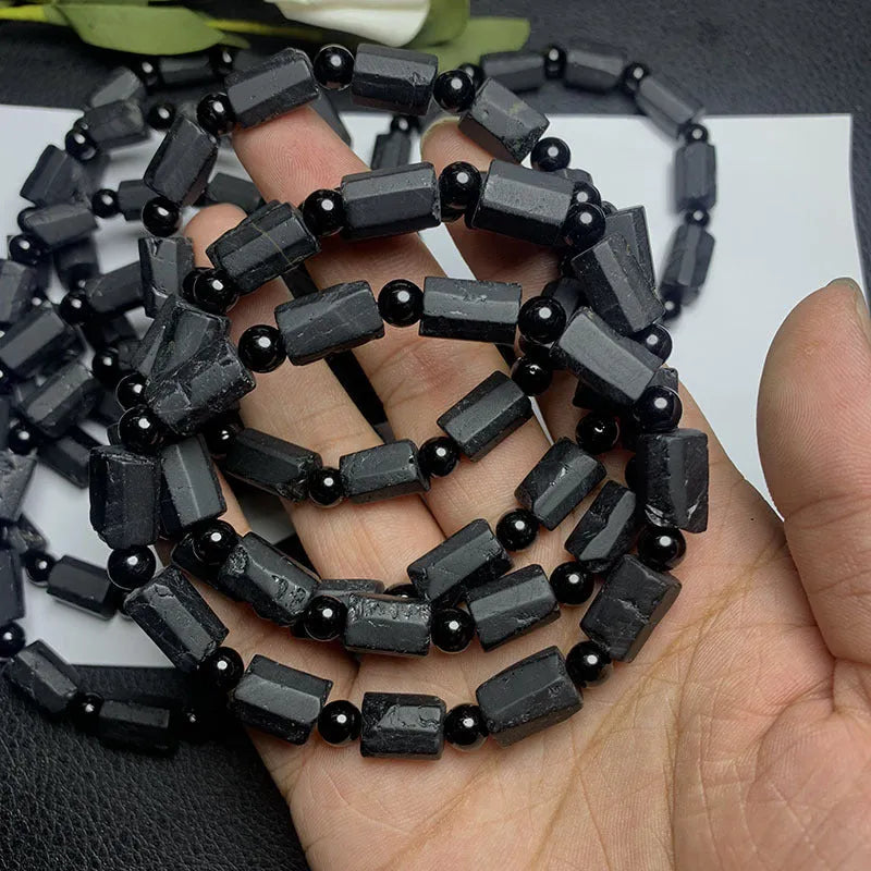Natural black tourmaline rough stone bracelet with approximately 9mm beads and seiko polished finish