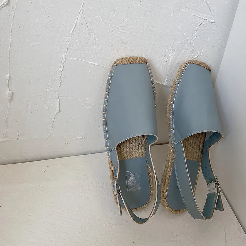 Women's beige retro fisherman flat sandals with canvas upper and flat sole.