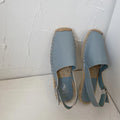 Women's beige retro fisherman flat sandals with canvas upper and flat sole.