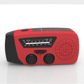 Red rechargeable emergency hand radio with built-in torch, showing compact size and wrist strap.