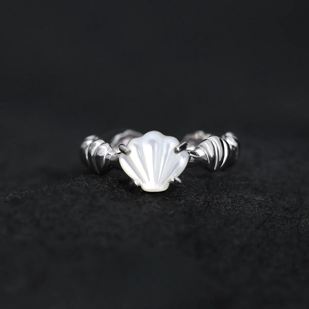 Women's adjustable silver ring featuring a shell and tiger eye stone with an electroplated gold tone finish.