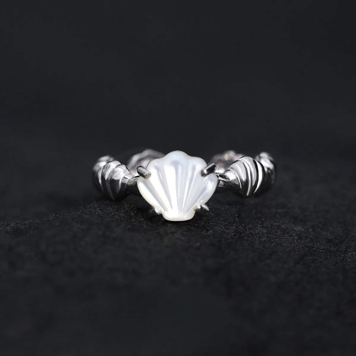 Women's adjustable silver ring featuring a shell and tiger eye stone with an electroplated gold tone finish.
