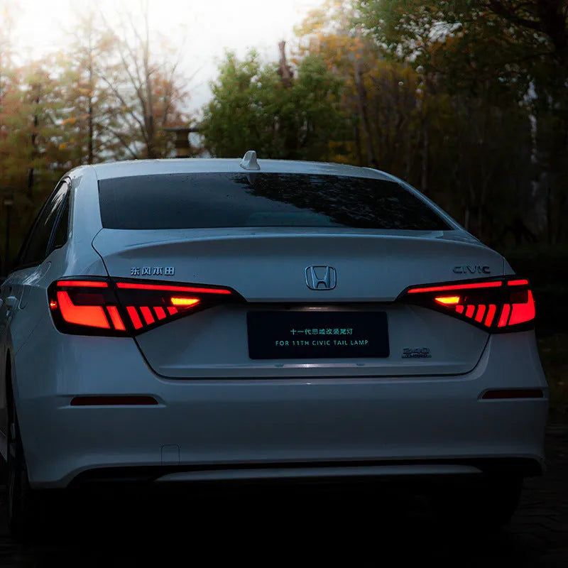11th Generation Honda Civic black and red LED taillight assembly with sequential turn signals.