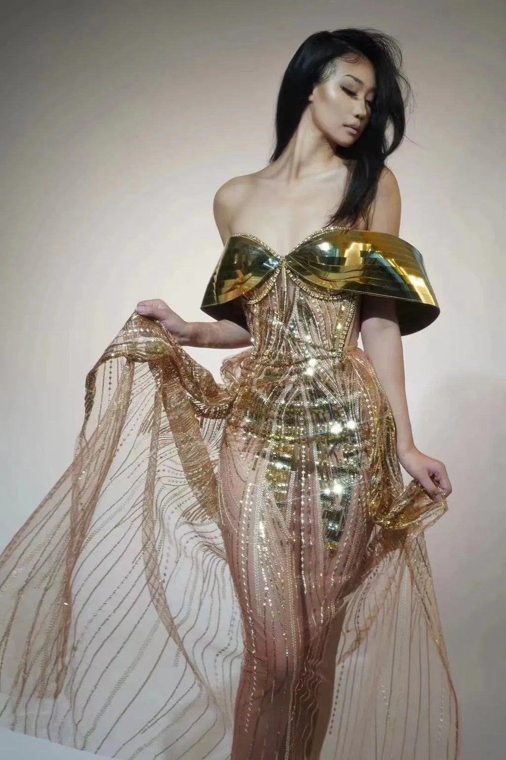 Gold strapless sequined evening dress with high split skirt and full sequin coverage