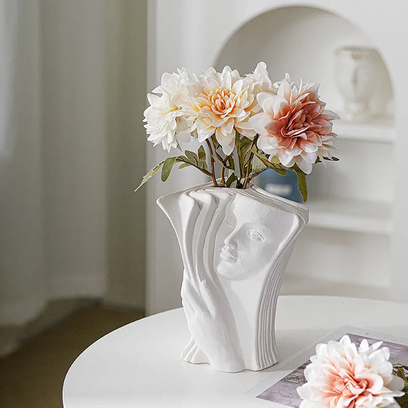 Ceramic book stand with glazed surface in a modern design, displayed on a desktop.