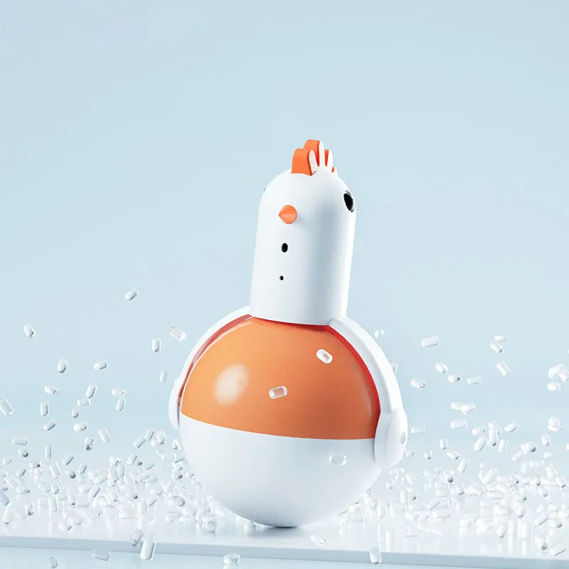 Green and orange electric cat toy chicken shape with laser light and motion features on a floor.