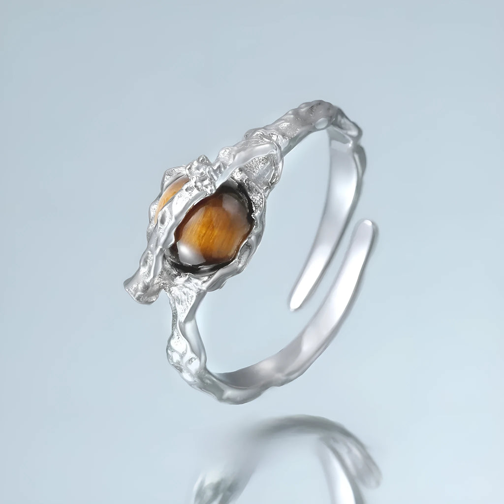 Women's Saturn open ring with adjustable size and electroplated white gold finish