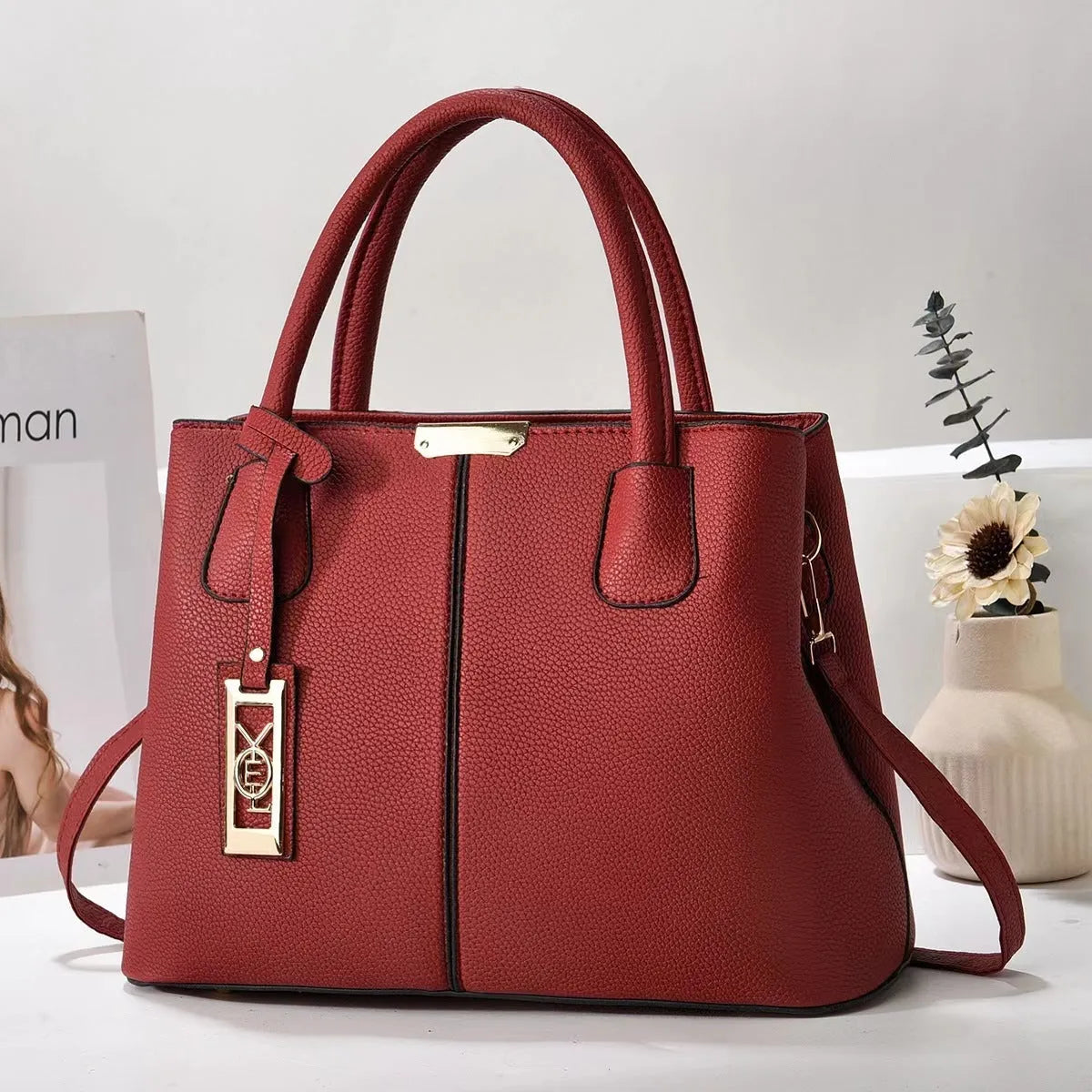 Soft PU women's tote bag in a horizontal square shape with a single leather shoulder strap, shown in a plaid pattern.