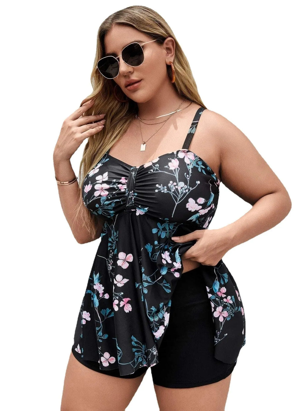 Women's floral print one-piece swimsuit on a hanger, showing split colour design