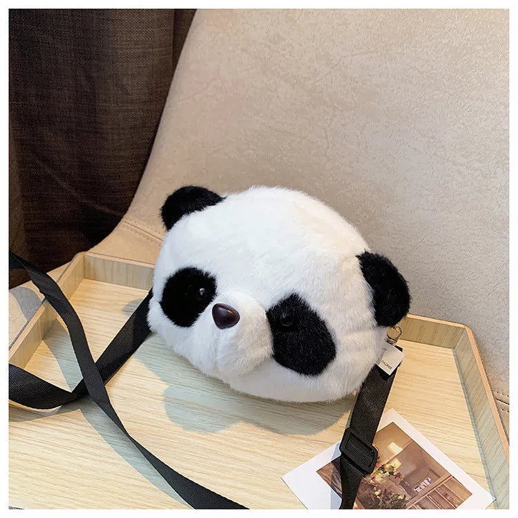 Plush cylindrical crossbody bag with panda head design measuring 18cm by 15cm by 8cm