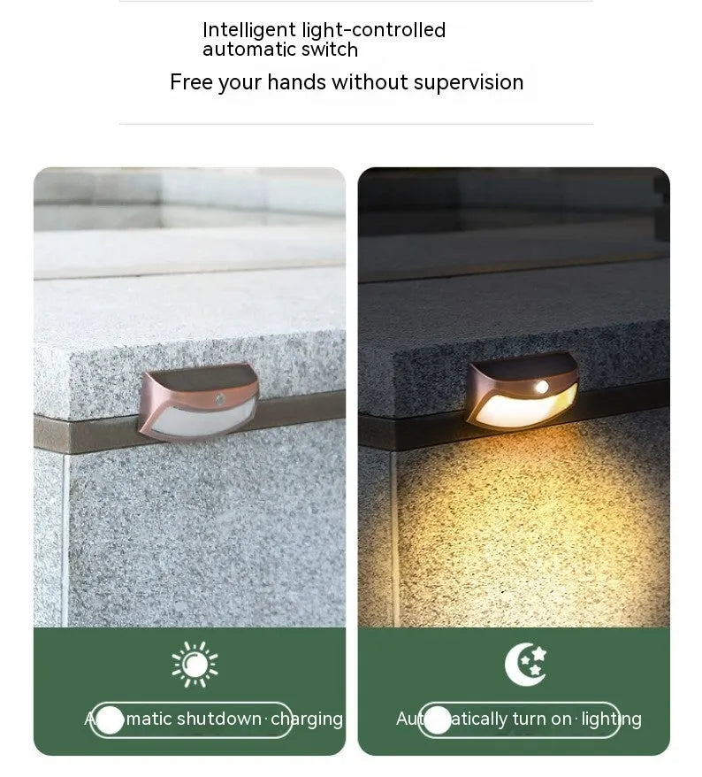 Solar outdoor wall lamp with smiling face design for garden lighting