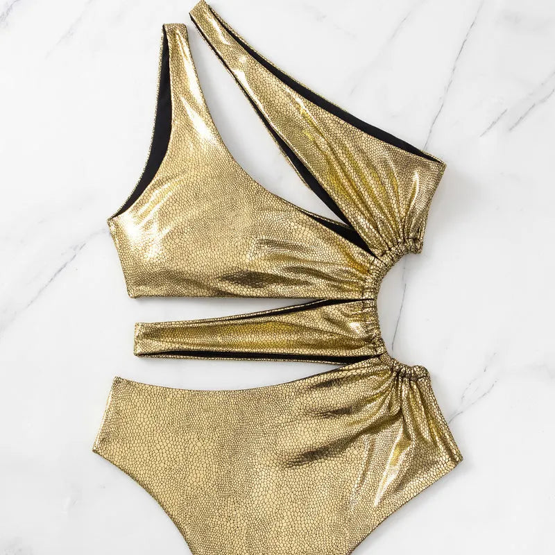 Women's solid gold one-piece swimsuit with backless, sleeveless design on a mannequin