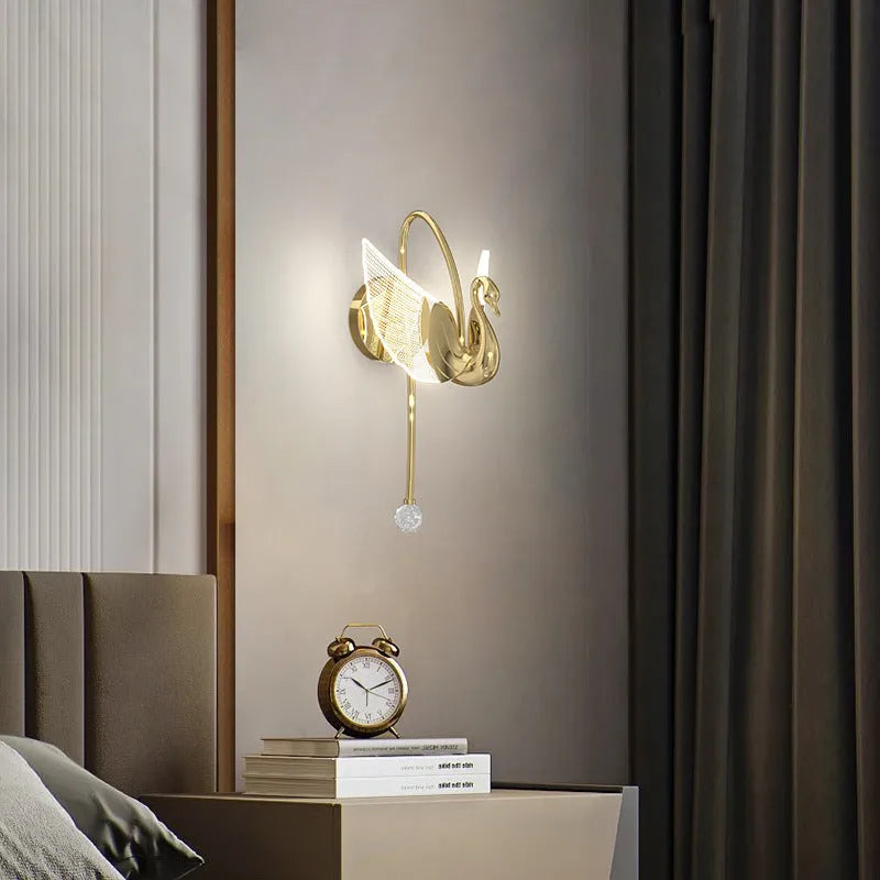Gold modern minimalist swan-shaped wall lamp with acrylic shade and iron construction