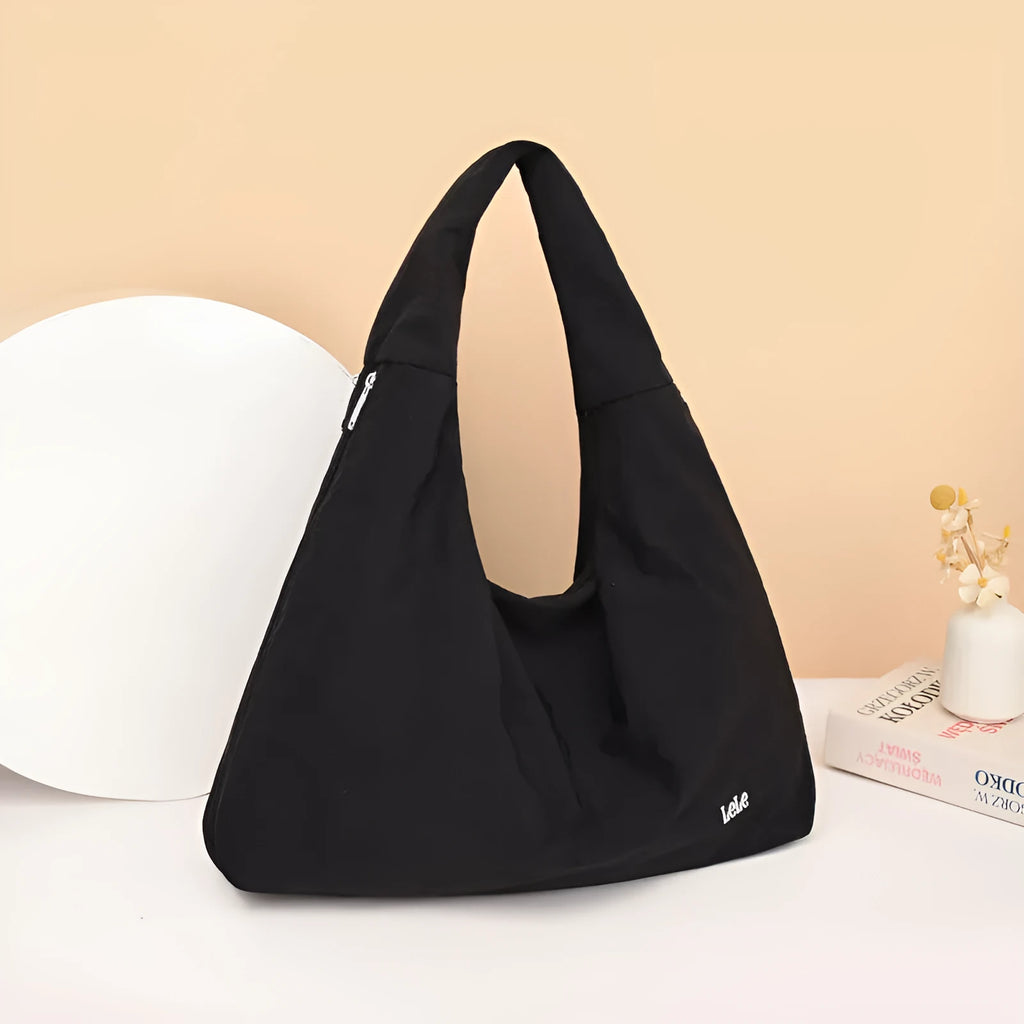 Heart-shaped nylon underarm bag for women in black, blue, khaki, and yellow colour options.