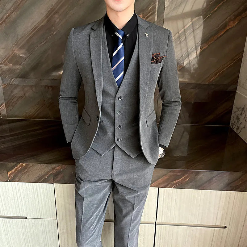 Slim fit business suit for men in black or dark grey with British style casual design