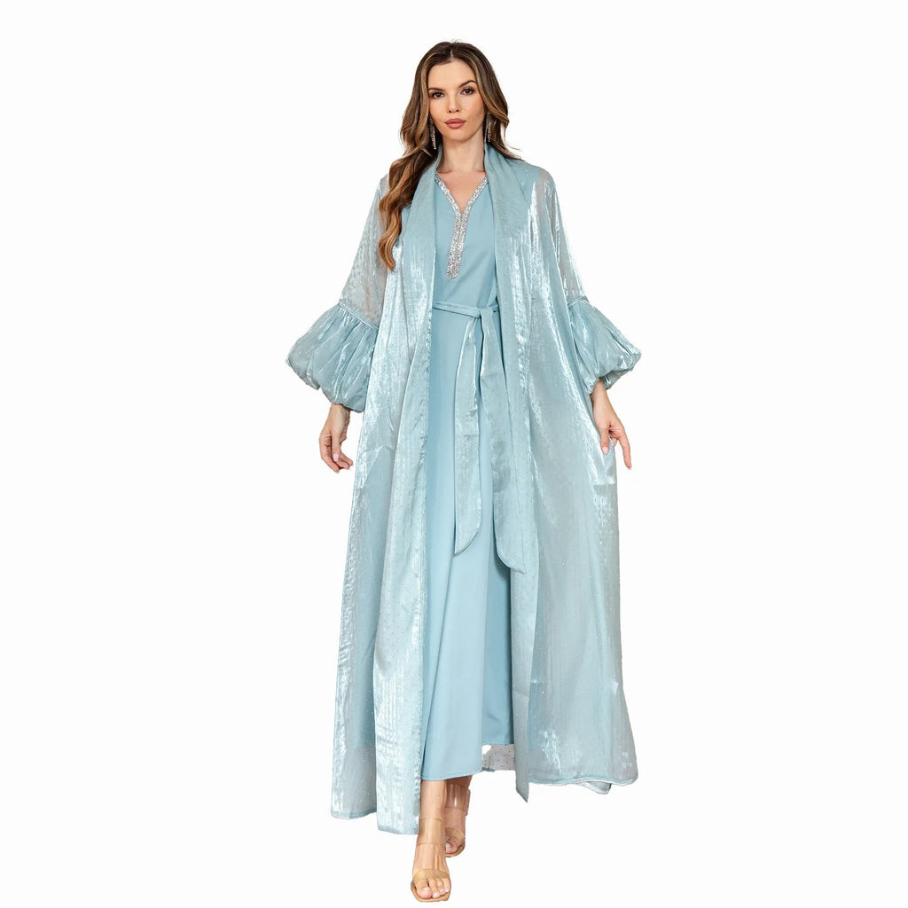 Arabic style two-piece dress set with long sleeves and rhinestone straps in blue.