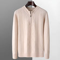 Men's grey diamond pattern wool half-zip sweater laid flat.