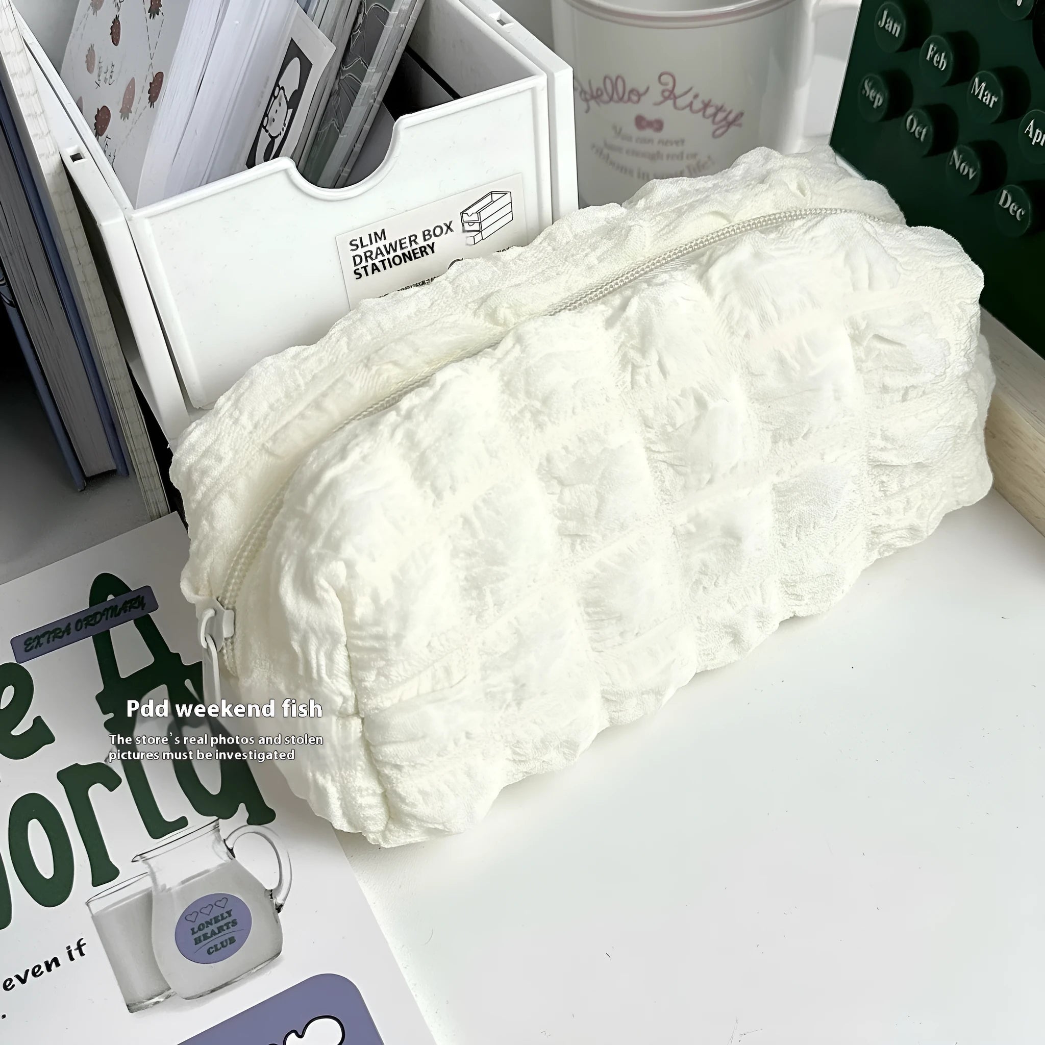 Beige or black polyester fabric pencil case with cream puff style texture and zip closure