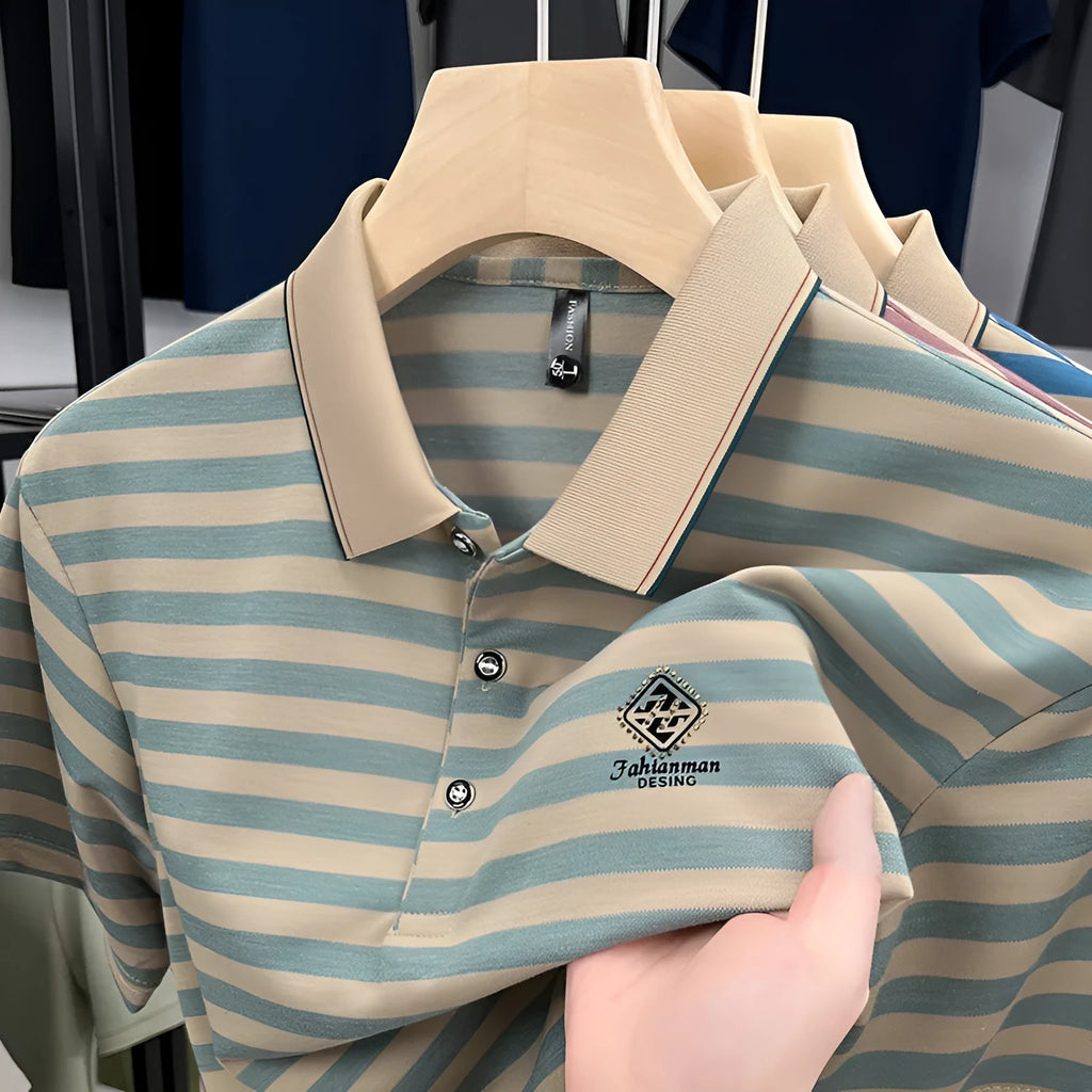 A man wearing a blue striped short sleeve casual top with a mosaic pattern design.