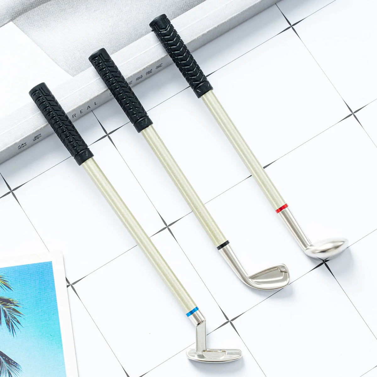 Three metal ballpoint pens with golf suit pattern design showing 0.7mm bullet-type pen heads
