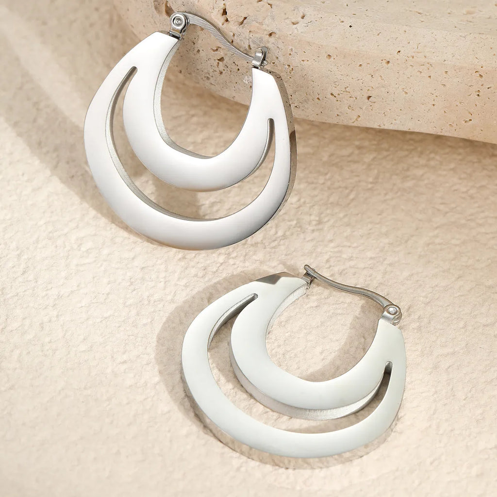 Geometric gold-plated French earrings with stainless steel construction and round ring design elements