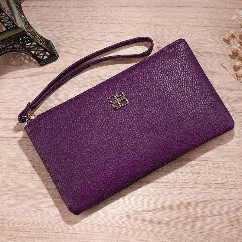 Long 55-inch PU leather phone wallet handbag with zipper closure in a solid colour.