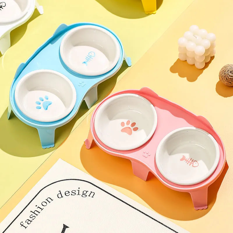 Ceramic elevated cat feeding bowl set with tilted bowls and stand in blue, pink, white or yellow
