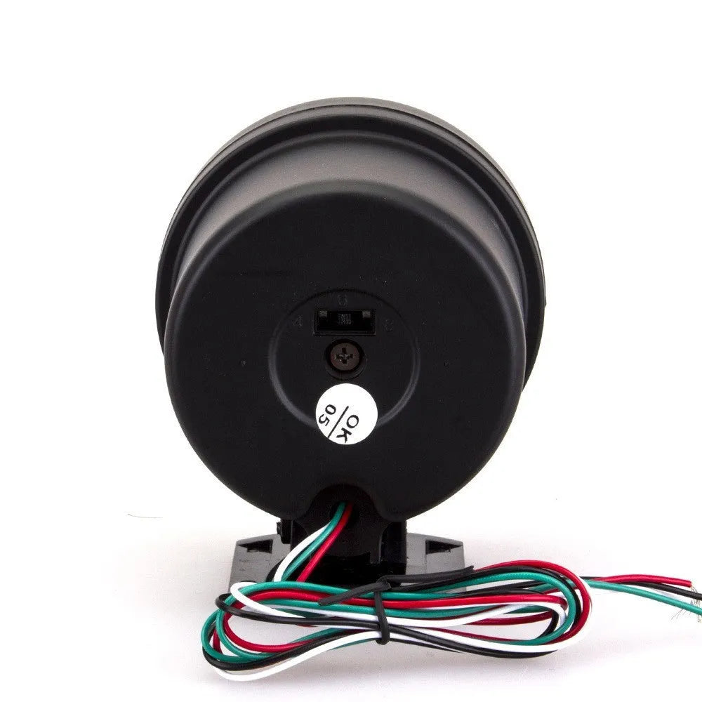 Black automotive tachometer with blue light pointer display and digital readout showing RPM measurement