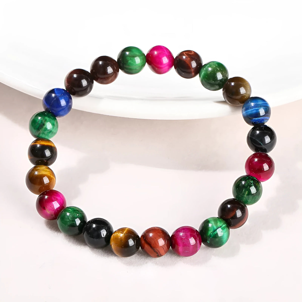 Geometric colourful Tiger Eye gemstone bracelet showing mixed natural colours on a string, available in multiple bead sizes.
