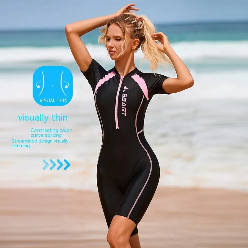 Women's solid colour one-piece swimsuit with short sleeves and chest pad for surfing and swimming.