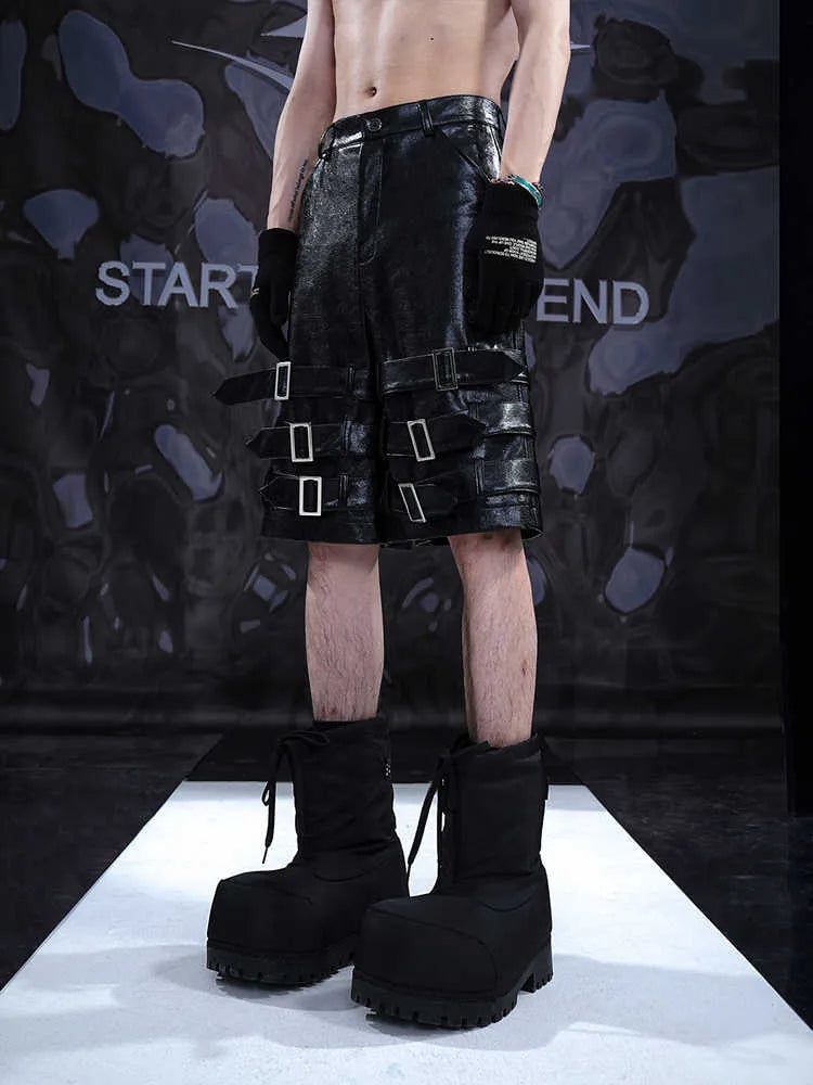 Men's black PU leather casual shorts with cropped length and a leather ring detail on the front.