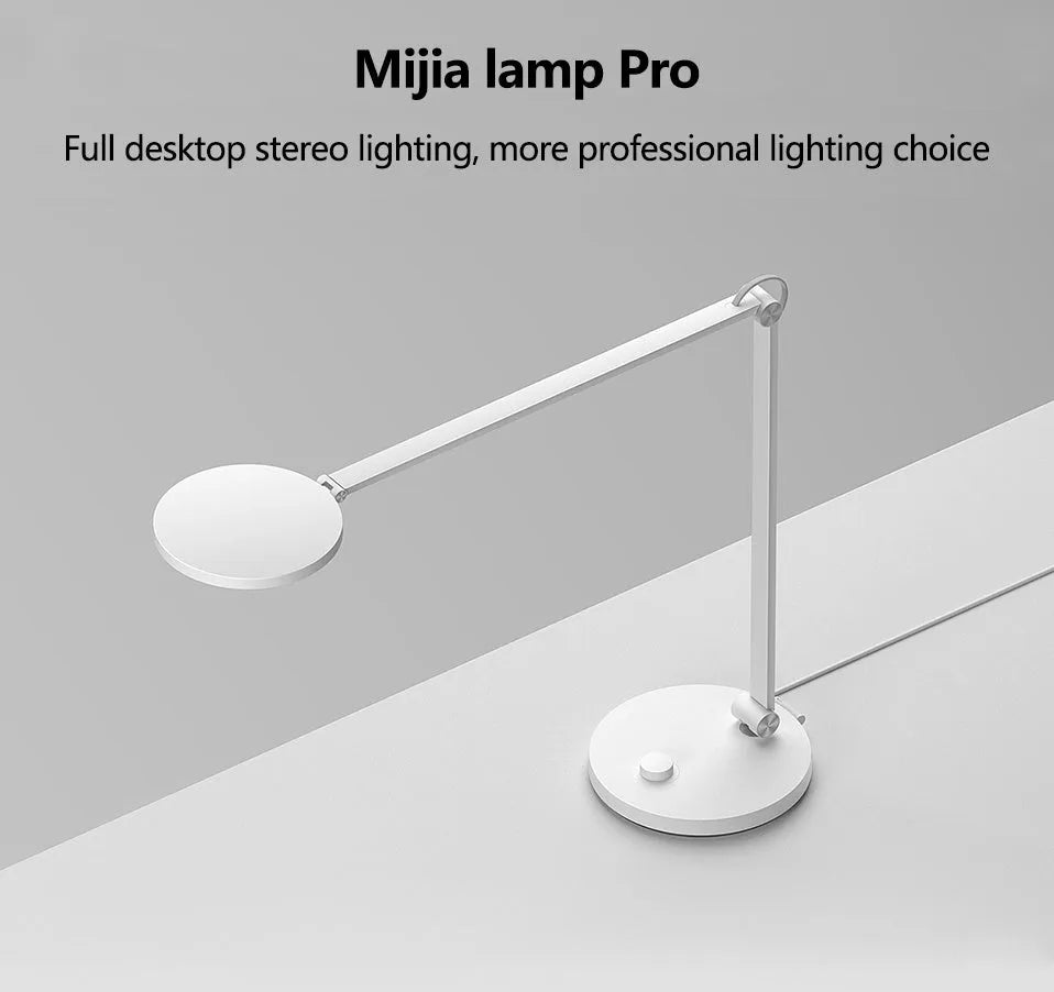 ProLED folding desk lamp with adjustable colour temperature and smart connectivity on a wooden desk.