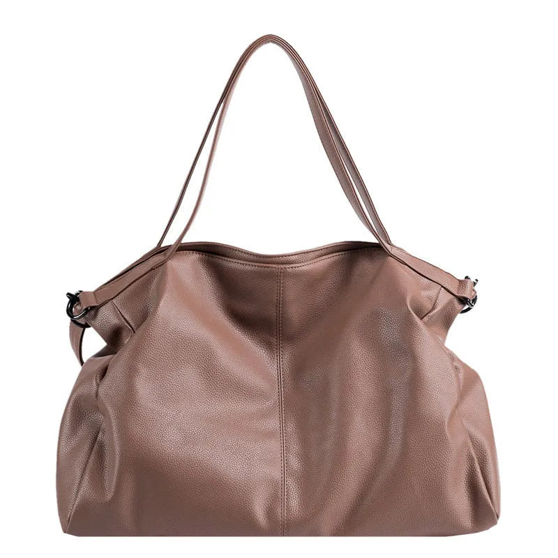 Large soft-surface PU leather messenger tote bag with long crossbody strap, shown in black colour