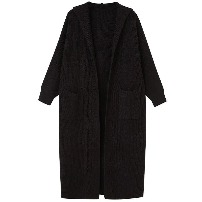 Long grey knitted hooded cardigan coat with trench coat styling on a model.