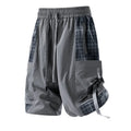 Men's loose fit cargo shorts with plaid stitching detail in black, light grey, and smoky grey.