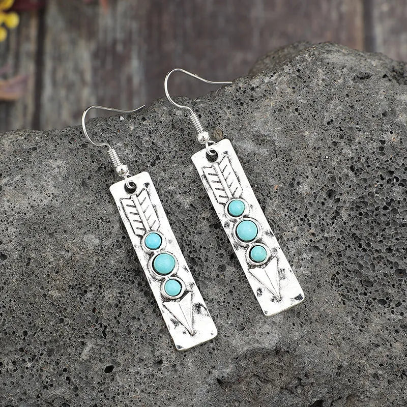 Long geometric silver earrings with turquoise inlays, zinc alloy construction