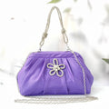 Women's soft polyester messenger bag with diamond folds and chain detailing in black colour
