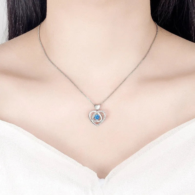 Blue diamond coloured beating heart necklace and bracelet set with gem inlaid pendant on electroplated copper.