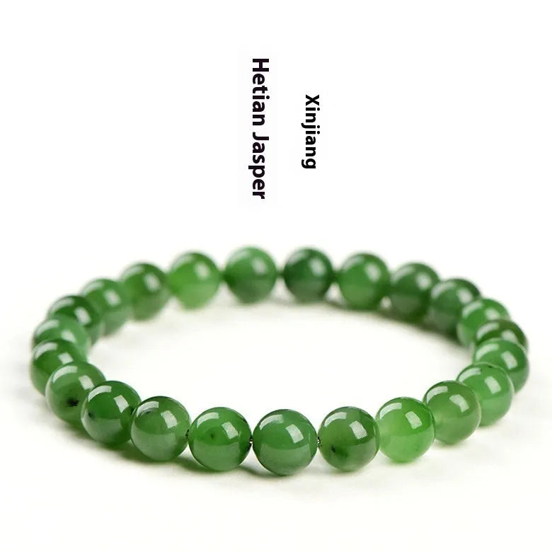 Natural Hetian jade beaded bracelet in various bead sizes on a plain background.
