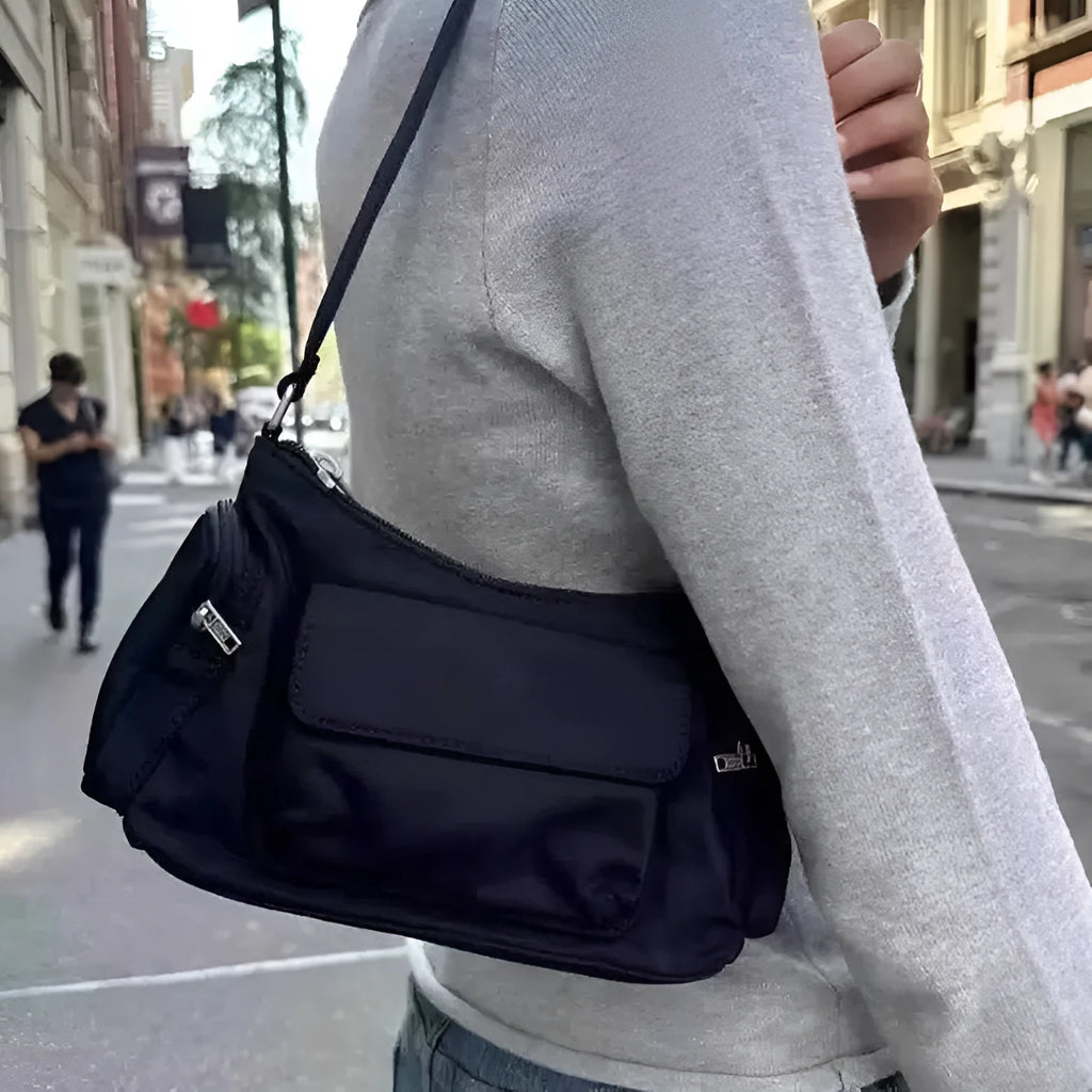 Black women's shoulder bag with double pockets and side line detail