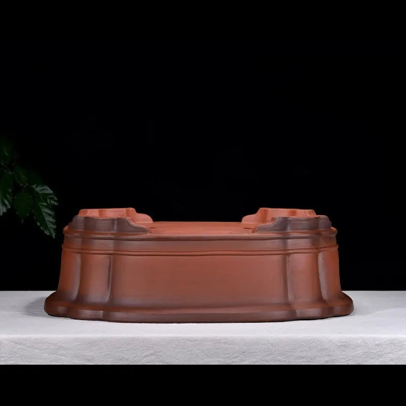 Large antique-look purple clay flowerpot with Chinese tree stump and floral patterns.