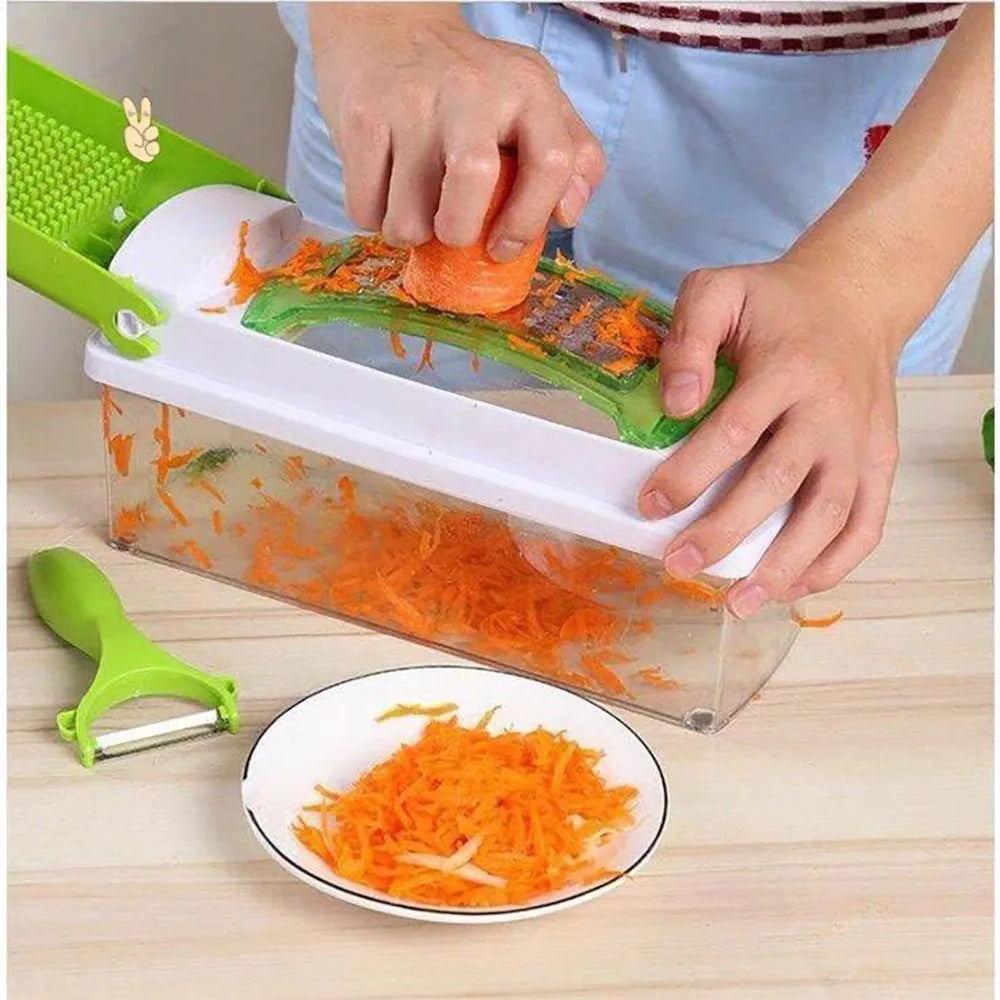 Green manual vegetable chopper with stainless steel blades and multiple cutting accessories on kitchen counter